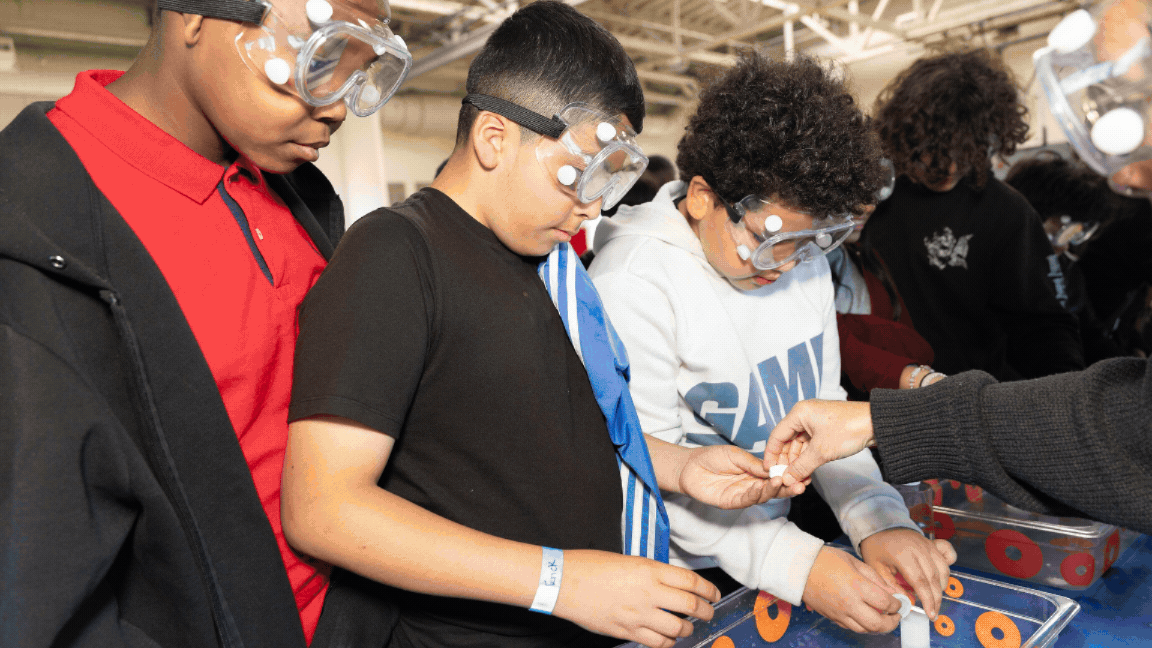 Blue Origin (1) Students engaging in science experiments.
